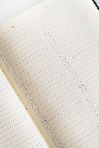 Open planner with a weekly layout on a white background