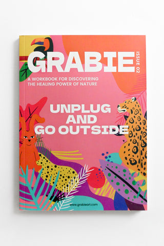 Colorful workbook cover titled 'GRABIE' with nature-themed illustrations on a white background
