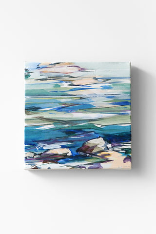 Abstract coastal painting depicting water and stones on a white background