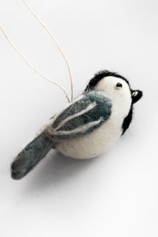 Felted bird ornament on a white background