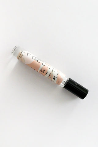 Roll-on bottle labeled 'Coconut Milk' on a white background