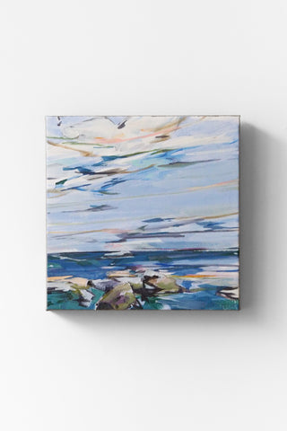 Abstract painting of an ocean horizon on a white wall