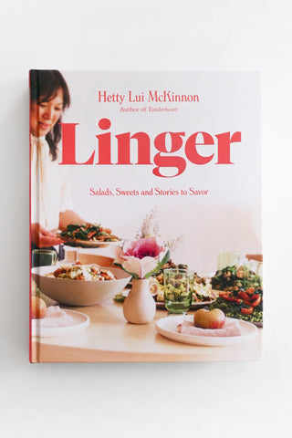 Book cover of 'Linger' by Hetty Lui McMinnon with a woman at a dining table.