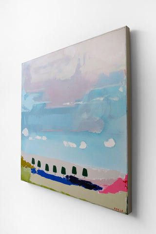 Abstract painting with a blue sky, white clouds, and colorful landscape on a white wall.