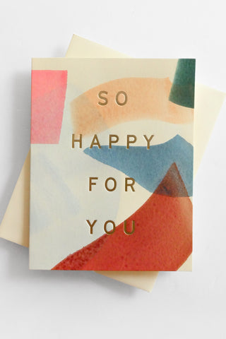 Greeting card with abstract design and 'So Happy For You' text on a light gray background