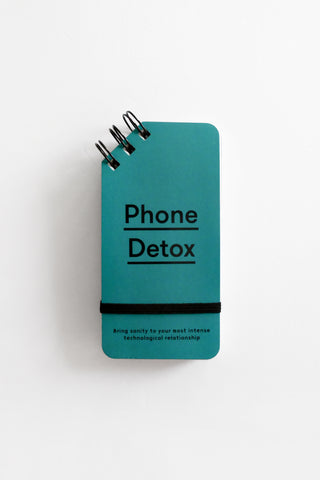 Blue notebook titled 'Phone Detox' on a white background