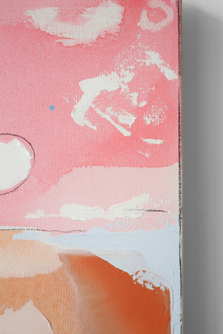 Close up of an abstract art painting with pink, orange, and white colors on a white surface.