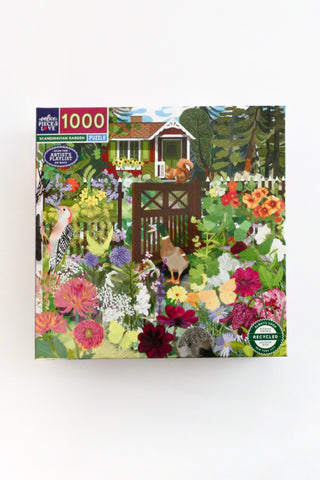 Jigsaw puzzle box with a garden scene design on a white background
