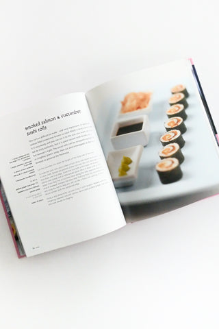 Open cookbook showing a page with sushi recipe and images