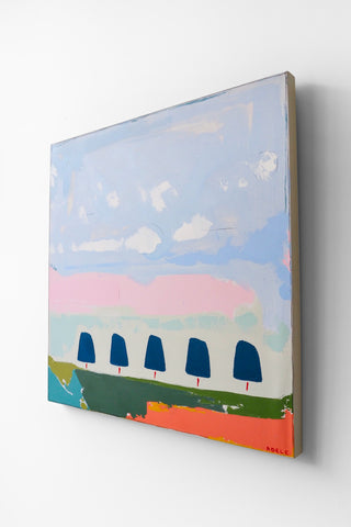 Abstract painting with colorful landscape and blue trees on a white wall
