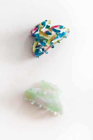 Colorful hair clips on a white background