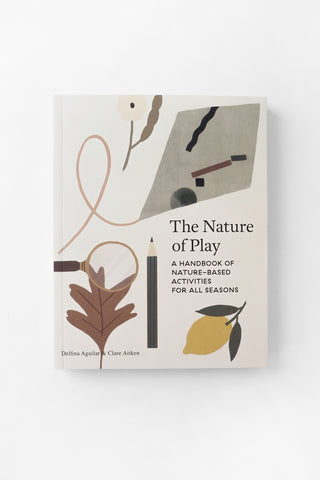 The Nature of Play: A Handbook of Nature-Based Activities for All Seasons book cover, featuring a minimalist beige background with illustrations of a leaf, pencil, lemon, and abstract sketch elements.