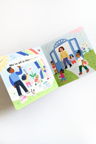 Children's books with illustrations of diverse families on a white background