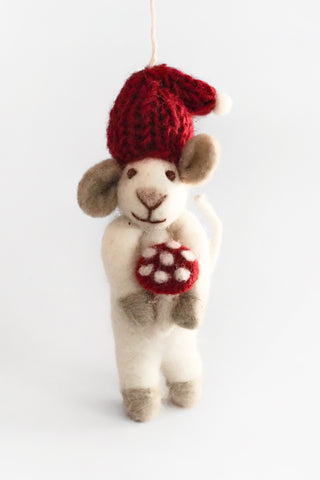 Decorative felted ornament with a red hat and a mushroom on a white background