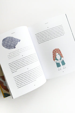 Open book with illustrations of a person with a patterned shirt and text on a white background.